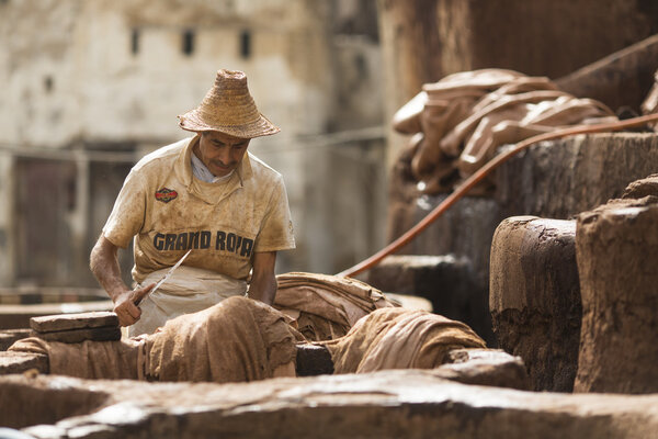 FEZ, MOROCCO - APRIL 19: Workers at leather factory perform the 