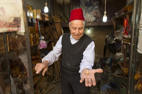 FES, MOROCCO, April 19: Unkown man selling wood materials in tra — Stock Photo, Image