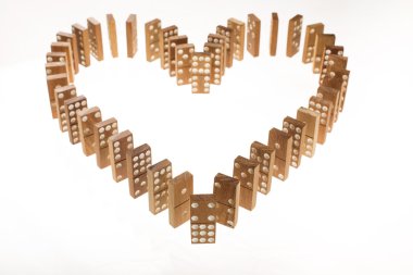 Dominoes standing in heart shape clipart