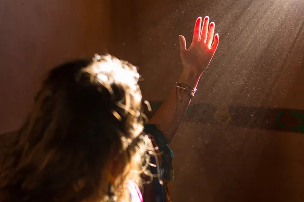 Woman hand into the light — Stock Photo, Image
