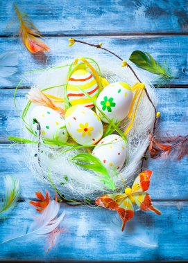 Handcrafted Easter eggs in the nest