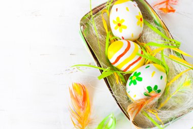 Handcrafted Easter eggs in the nest