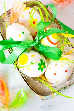 Handcrafted Easter eggs in the nest