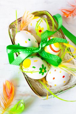 Handcrafted Easter eggs in the nest