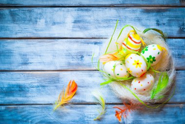 Handcrafted Easter eggs in the nest