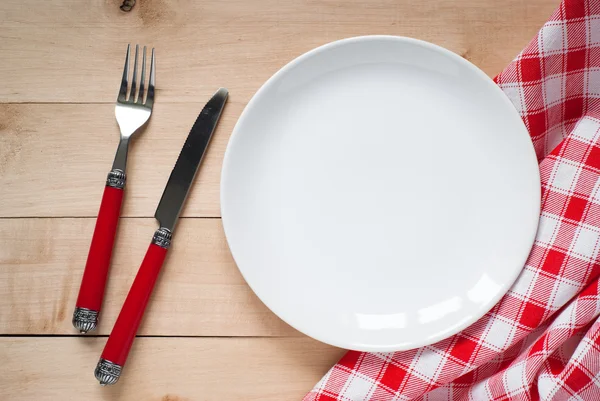 Table setting with a plate, cutlery and napkin — Stock Photo, Image