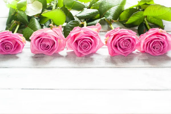 Pink roses on wooden — Stock Photo, Image