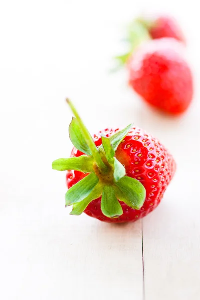 Strawberry at wooden table — Stock Photo, Image