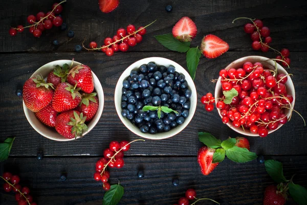 Bowls with different berries — Stock Photo, Image