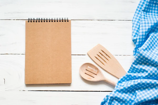 Cooking utensils on white wooden table — Stock Photo, Image