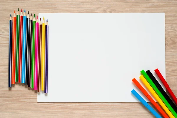 Pencils, crayons and album sheet — Stock Photo, Image