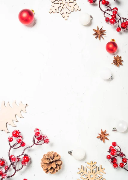 Christmas composition with red decorations at white table. — Stock Photo, Image