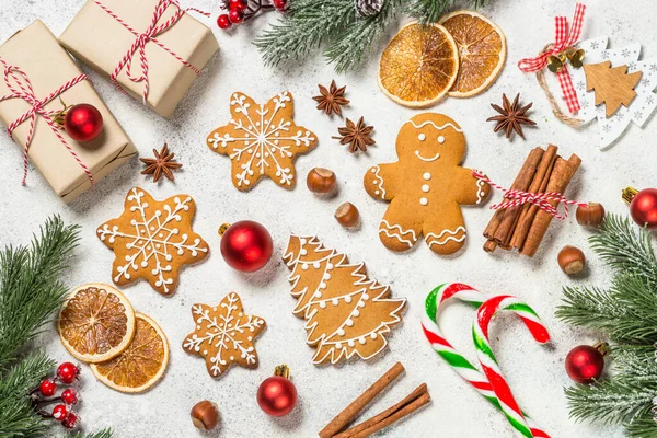 Christmas gingerbread cookies with spices and holidays decorations at white table. — Stock Photo, Image