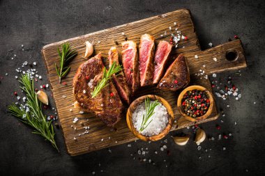 Grilled beef steak with herbs. clipart