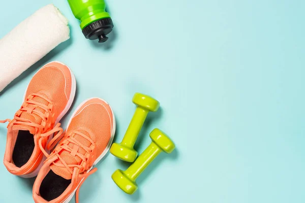 Fitness equipment at blue background top view. — Stock Photo, Image