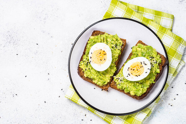 Avocado Sandwiches on white background.