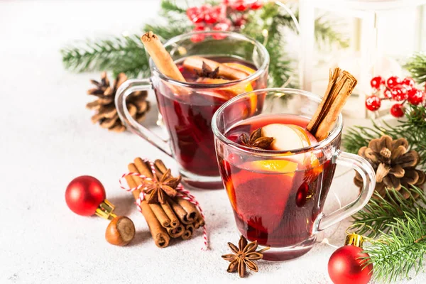 Mulled wine with christmas decorations on white. — Stock Photo, Image