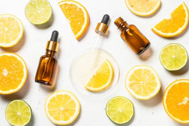 C vitamini kozmetik ürünleri ve taze narenciye meyveleri..