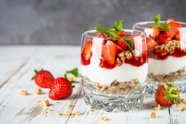 Greek yogurt parfait with strawberry at white background. — Stock Photo, Image