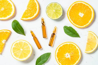 C vitamini kozmetik ürünleri ve taze narenciye meyveleri..