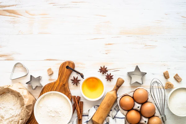 Baking ingredients at white wooden table. — Stock Photo, Image
