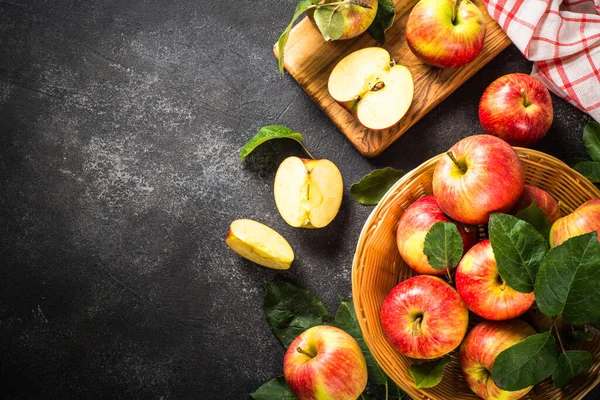 Fresh ripe red apples in the basket at white table. — Stock Photo, Image