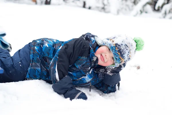 Happy boy in the snow — Stock Photo, Image