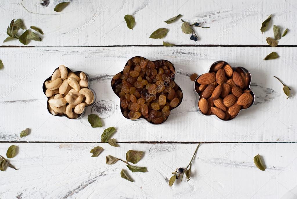 Almonds, cashews and raisins in a cookie cutters