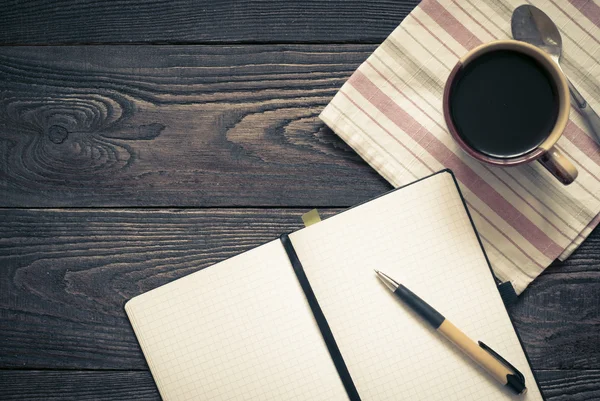 Notebook and a cup of coffee — Stock Photo, Image