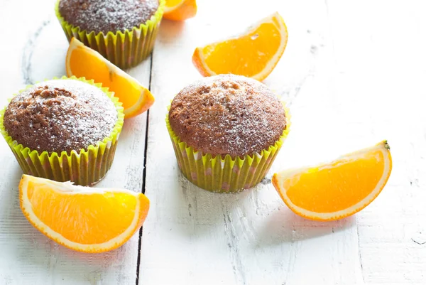 Orange muffins at the  table — Stock Photo, Image