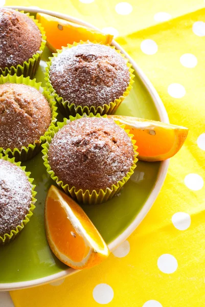 Orange muffins on the  plate — Stock Photo, Image