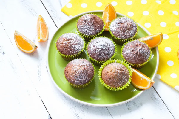 Orange muffins on the plate — Stock Photo, Image