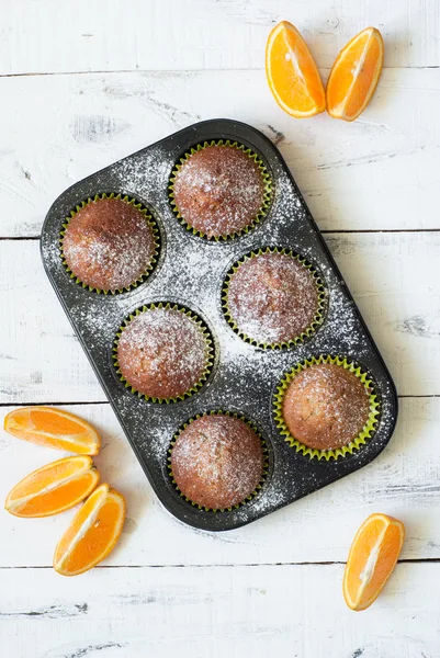 Orange muffins in baking dish — Stock Photo, Image