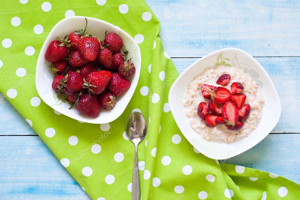 Milk oatmeal porridge with strawberries
