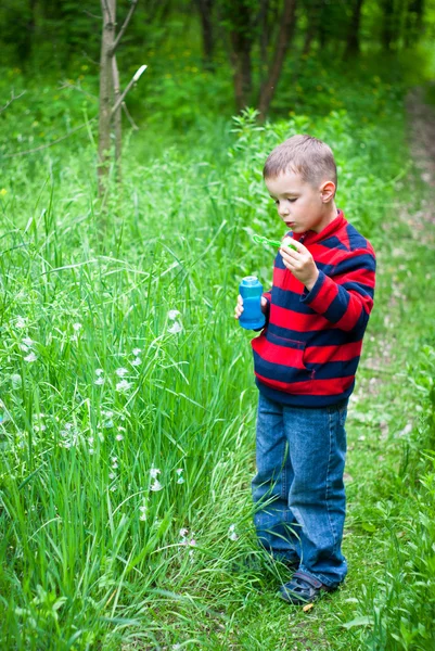 Boy and bubbles — Stock Photo, Image