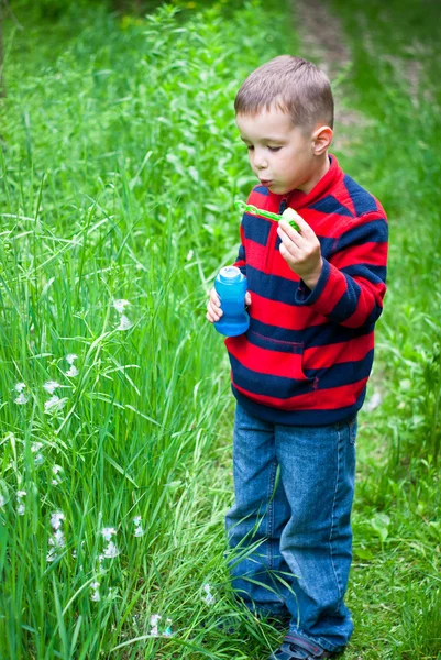 Boy and bubbles — Stock Photo, Image