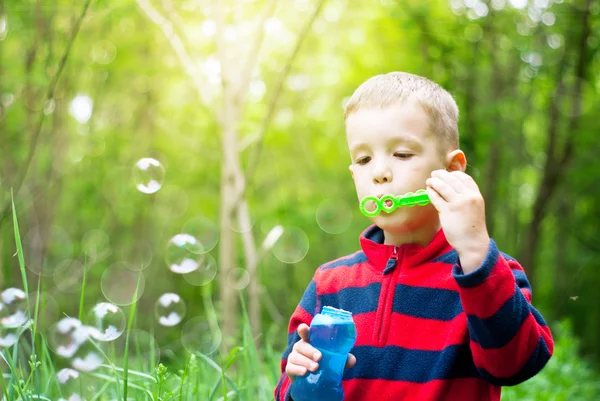 Boy and bubbles — Stock Photo, Image