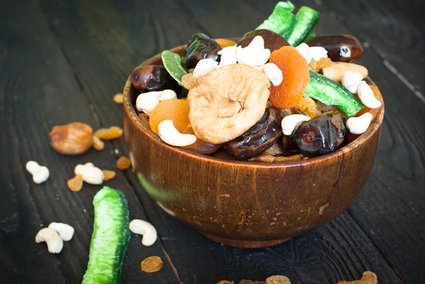 Dried fruits in a wooden bowl — Stock Photo, Image