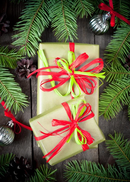 Christmas present with firtree branches — Stock Photo, Image