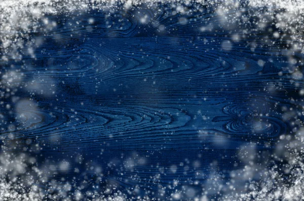 Dark wooden background with snowflakes — Stock Photo, Image