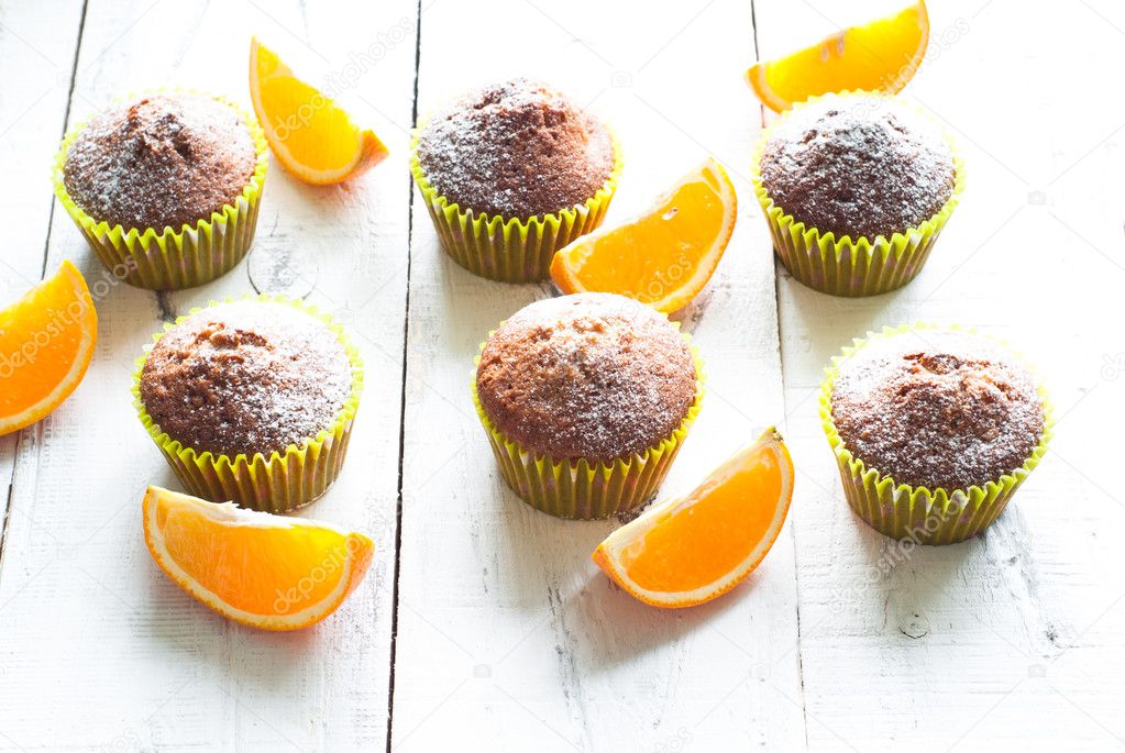 Orange muffins at the  table 