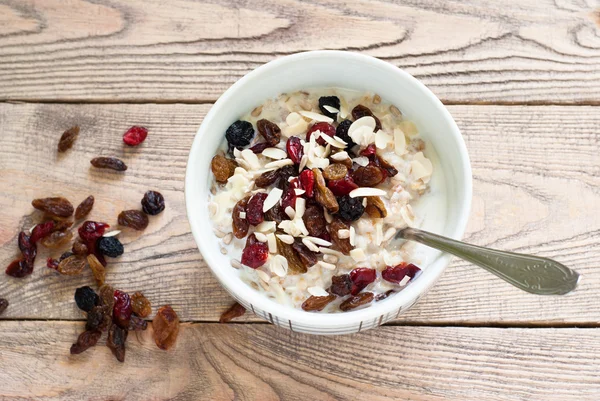 Oatmeal with dried fruit. — Stock Photo, Image