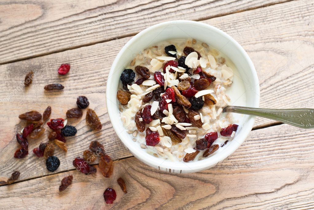 Oatmeal with dried fruit. Stock Photo by ©Nadianb 91401220