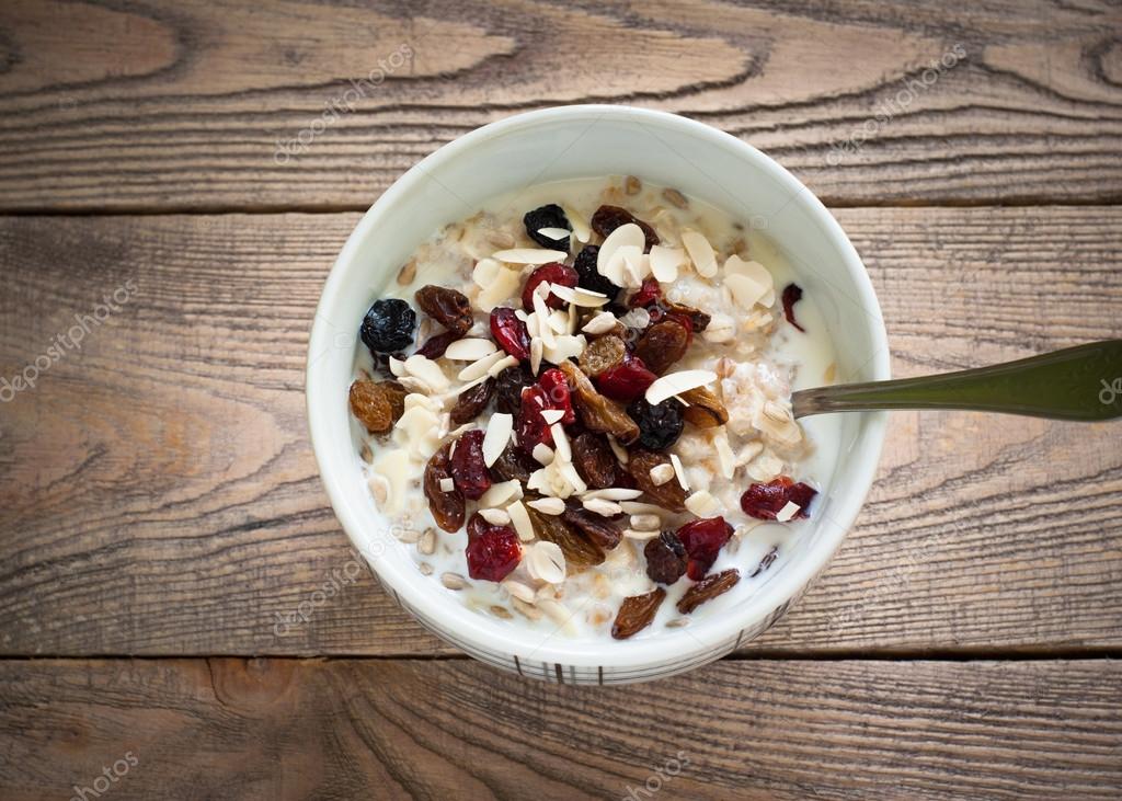 Oatmeal with dried fruit. — Stock Photo © Nadianb 91404368