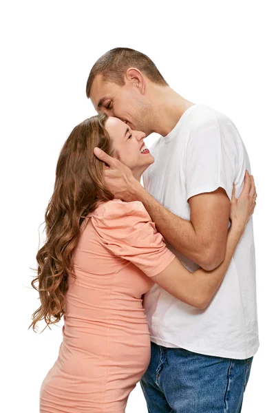 Kissing pregnant couple — Stock Photo, Image