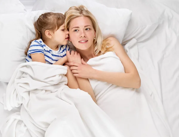 Mother and daughter whispering Royalty Free Stock Photos