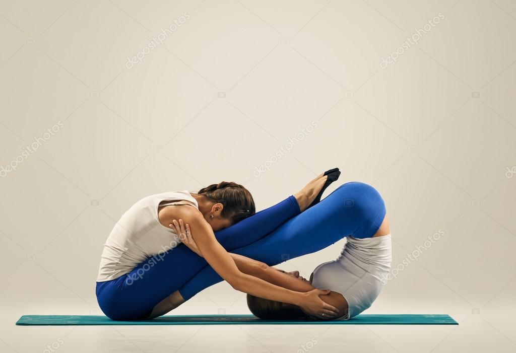 depositphotos_121142696 stock photo yoga in pair floor