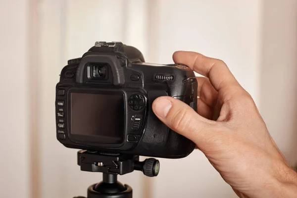 Photo camera with hand — Stock Photo, Image