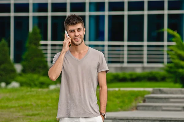 Young man and mobile phone — Stock Photo, Image
