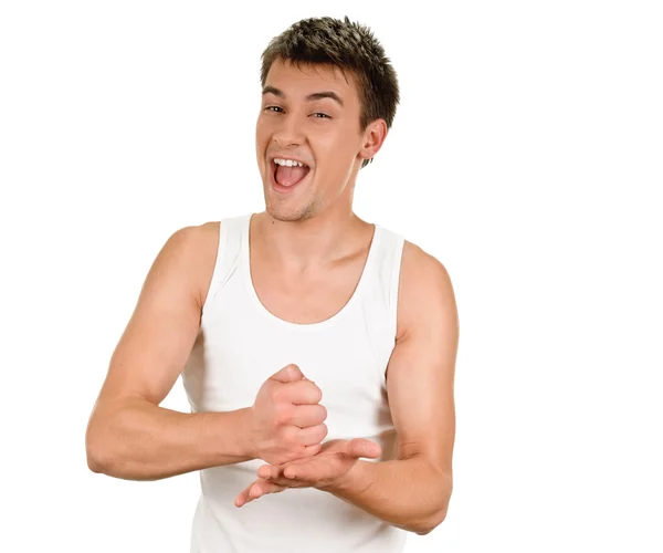 Exited young man kicks clenched fist arm — Stock Photo, Image